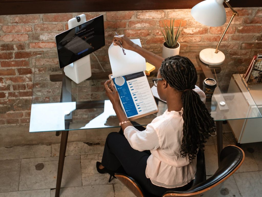 Women working clipboard